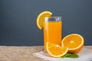 glass-orange-juice-placed-wood_1150-9666.jpg