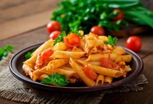 penne-pasta-tomato-sauce-with-chicken-tomatoes-wooden-table_2829-19739.jpg