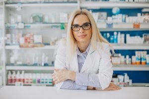 woman-working-pharmacy-wearing-coat_1303-26270.jpg